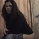 A girl with wavy, long brunette hair blows some stinky, wet farts and belches while sitting on a toilet. Air is coming out of every hole in her body!